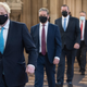 Prime Minister Boris Johnson (L) and Labour leader Sir Keir Starmer (2nd L) walk through the Central Lobby after listening to the Queen’s Speech during the State Opening of Parliament in the House of Lords at the Palace of Westminster on May 11, 2021 in London, England.